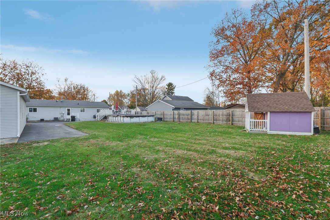 167 Birch Road Painesville, OH 44077 - Photo 43 of 49 View of yard with an outbuilding and a patio