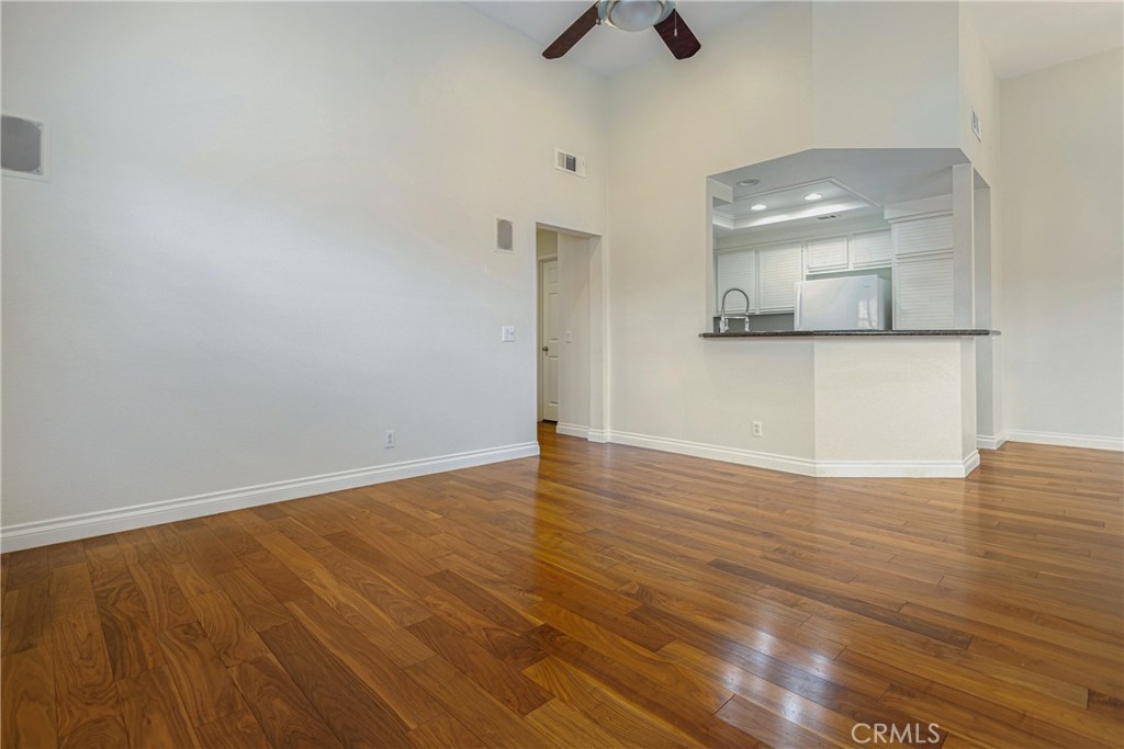 23 Ericson Aisle Irvine, CA 92620 - Photo 12 of 28 a view of empty room with wooden floor