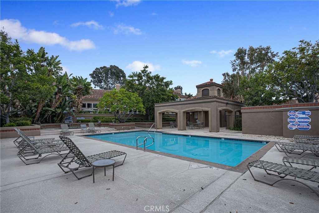 23 Ericson Aisle Irvine, CA 92620 - Photo 27 of 28 a view of a house with backyard sitting area and tub