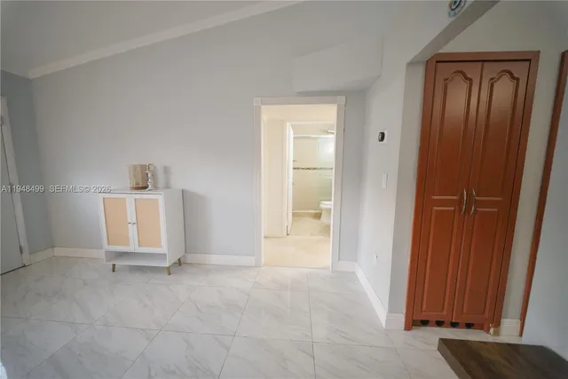 a utility room with cabinets washer and dryer