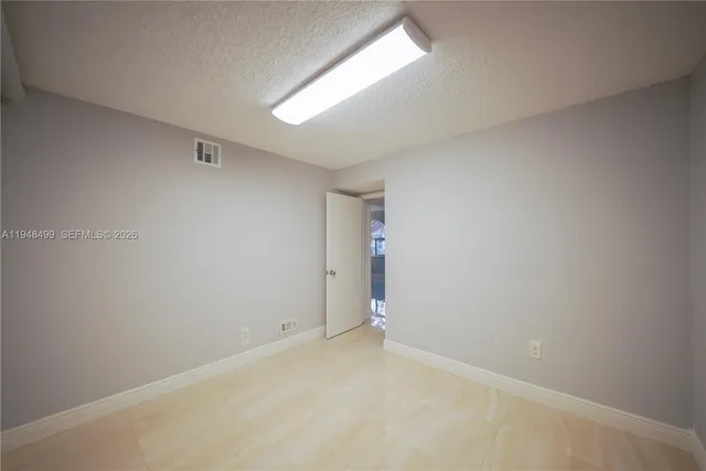 a room with furniture and wooden floor