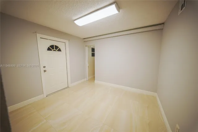 a bedroom with furniture and a wooden floor