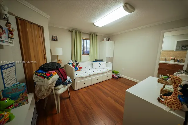 a bed room with a bed and a mirror