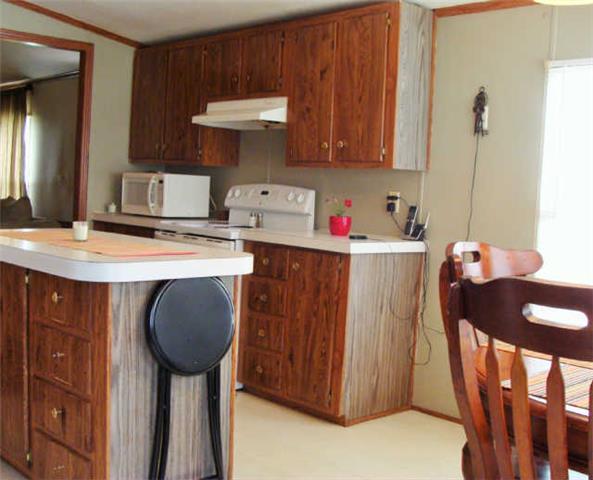 1174 Port Royal Road Adams, TN 37010 - Photo 12 of 16 Another view of the kitchen. Stove and microwave stay, too.