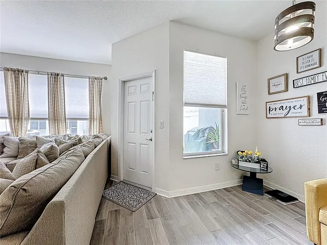a view of a livingroom with furniture and wooden floor