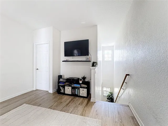 a bedroom with a bed dresser and a window