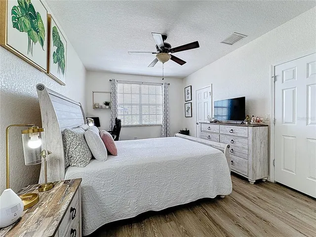 a view of walk in closet with clothes