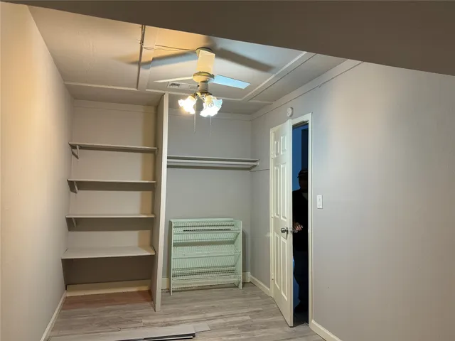 a view of an empty walk in closet