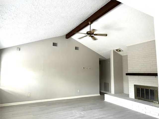 a view of livingroom with hardwood floor and kitchen