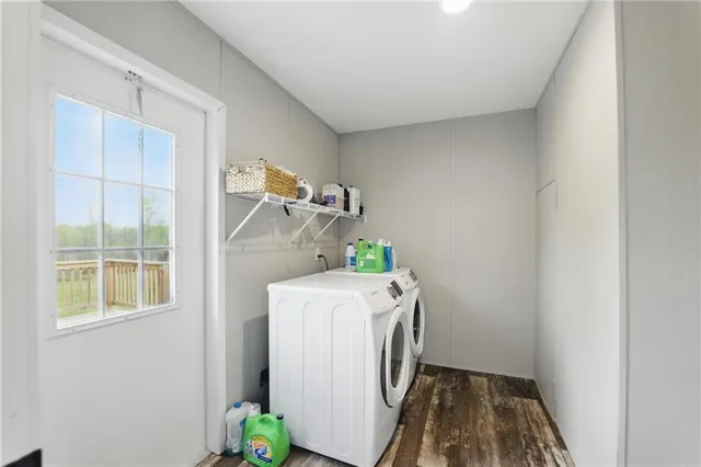 a bathroom with a granite countertop sink and toilet