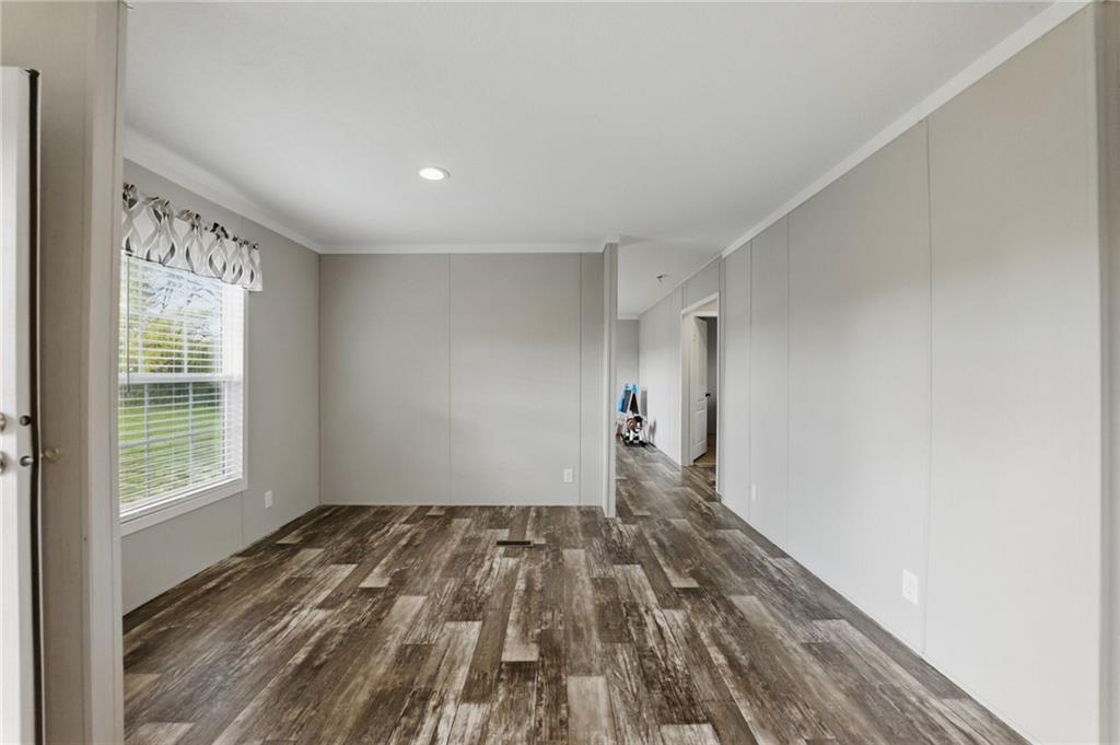 262 Garrison Road Carnesville, GA 30521 - Photo 15 of 59 a view of empty room with wooden floor and fan