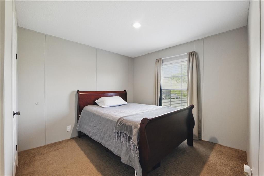 262 Garrison Road Carnesville, GA 30521 - Photo 20 of 59 a bedroom with a bed and a window