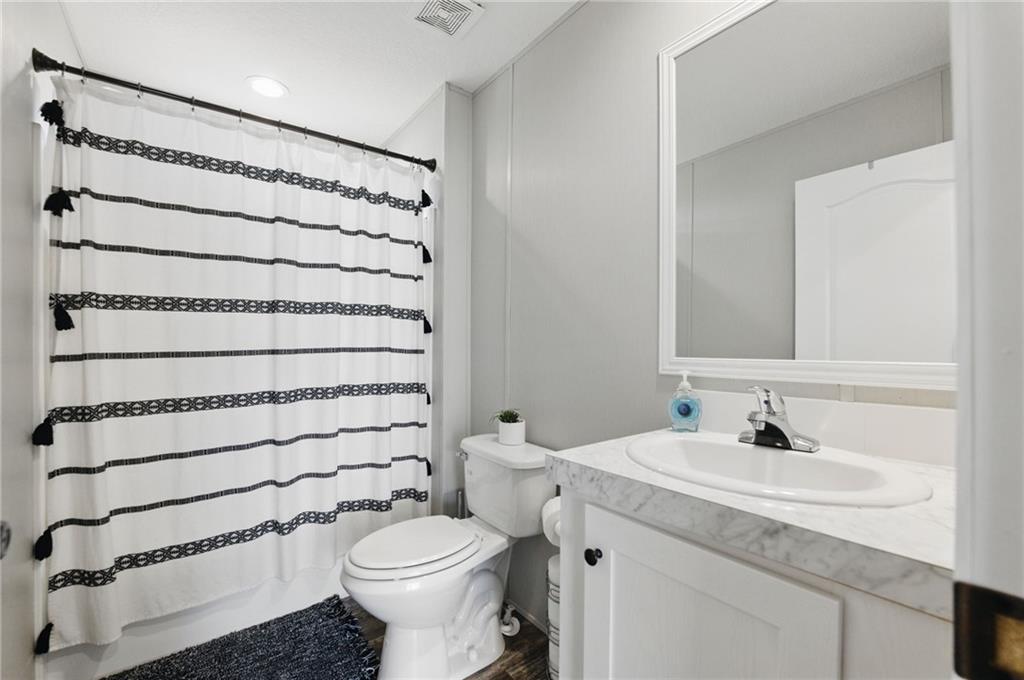 262 Garrison Road Carnesville, GA 30521 - Photo 21 of 59 a bathroom with a sink toilet and shower