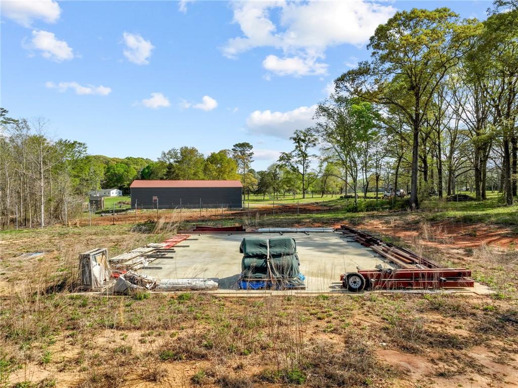 262 Garrison Road Carnesville, GA 30521 - Photo 49 of 59 a view of a yard with swimming pool and trees