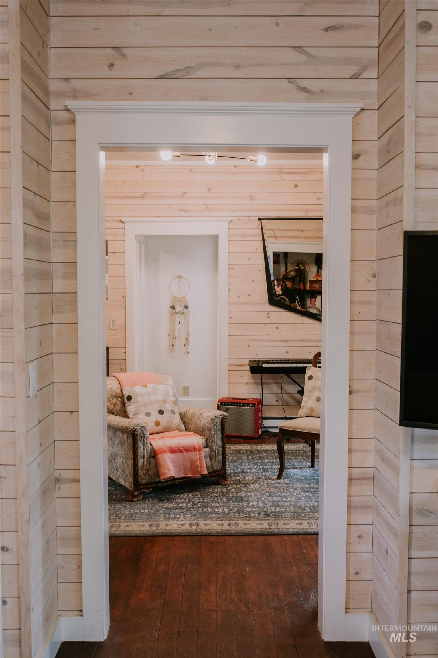 104 North Fairfield Street Council, ID 83612 - Photo 11 of 32 Hall featuring wooden walls and dark wood finished floors