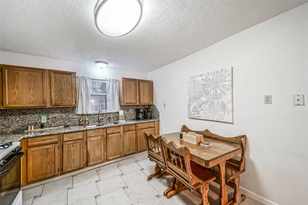 a view of a kitchen area with furniture and window