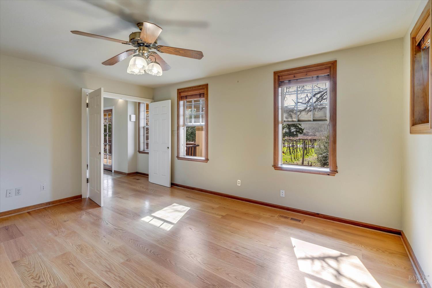 20 Rosedale Road Calistoga, CA 94515 - Photo 23 of 47 a view of an empty room with a window and wooden floor