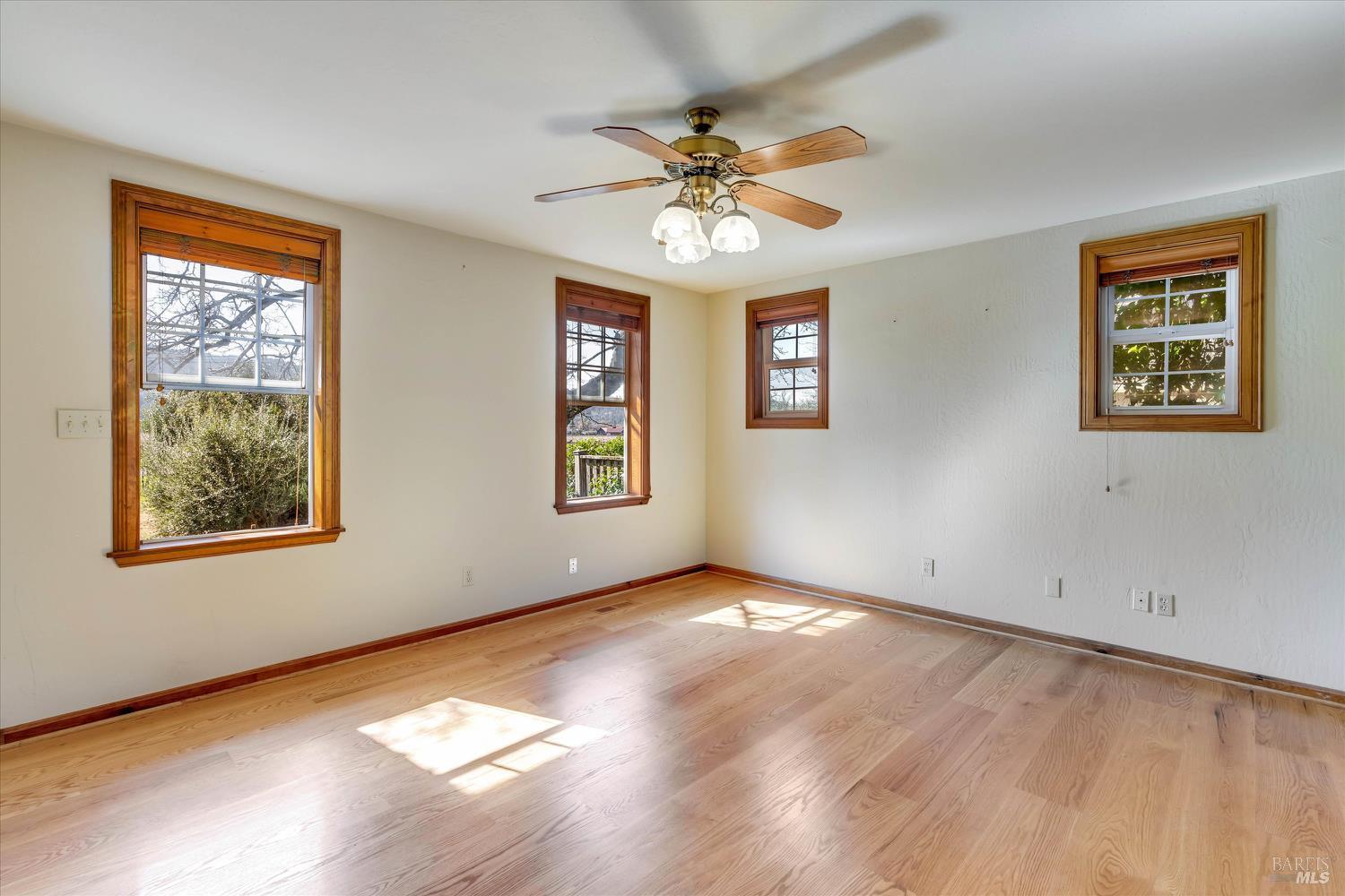 20 Rosedale Road Calistoga, CA 94515 - Photo 25 of 47 a view of an empty room with a window and wooden floor