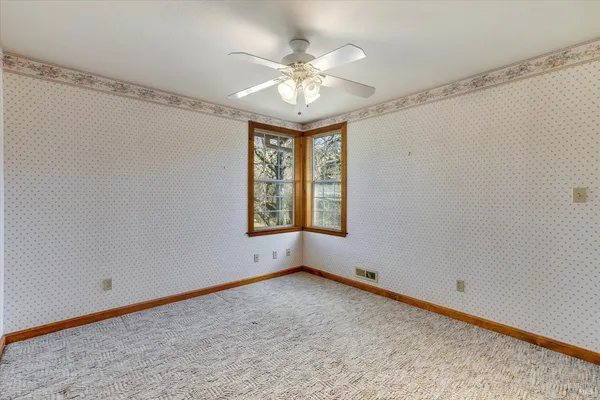 a view of a swimming pool with a yard