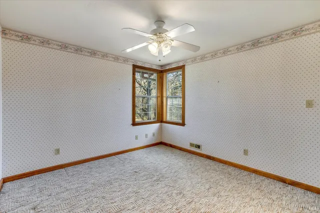 a view of a swimming pool with a yard