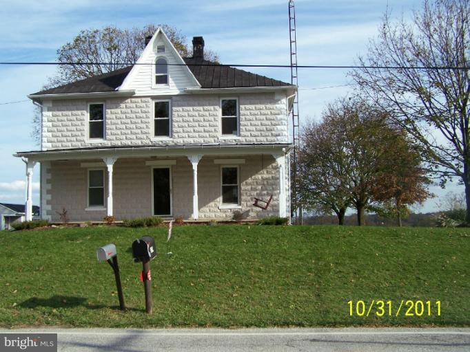 529 North Clear Ridge Road Union Bridge, MD 21791 - Photo 3 of 30 a front view of a house with a garden