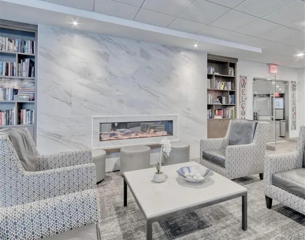 a living room with furniture and a rug