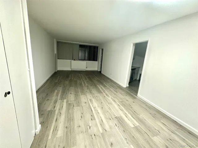 a view of wooden floor in an empty room