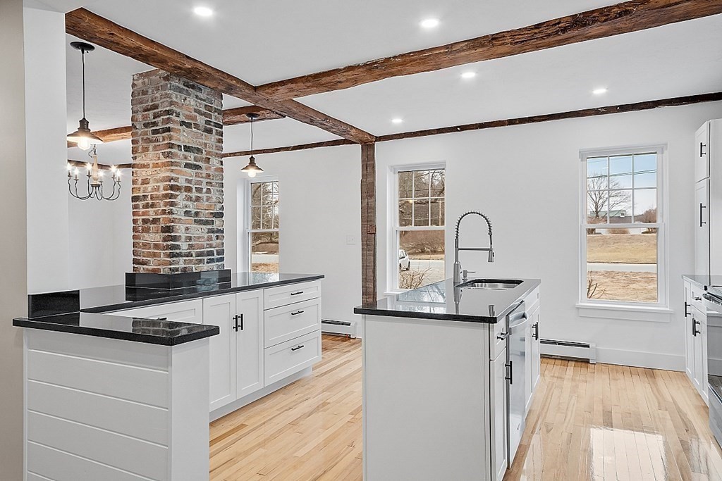 335 Chase Road Lunenburg, MA 01462 - Photo 13 of 42 a kitchen with granite countertop a sink and a stove