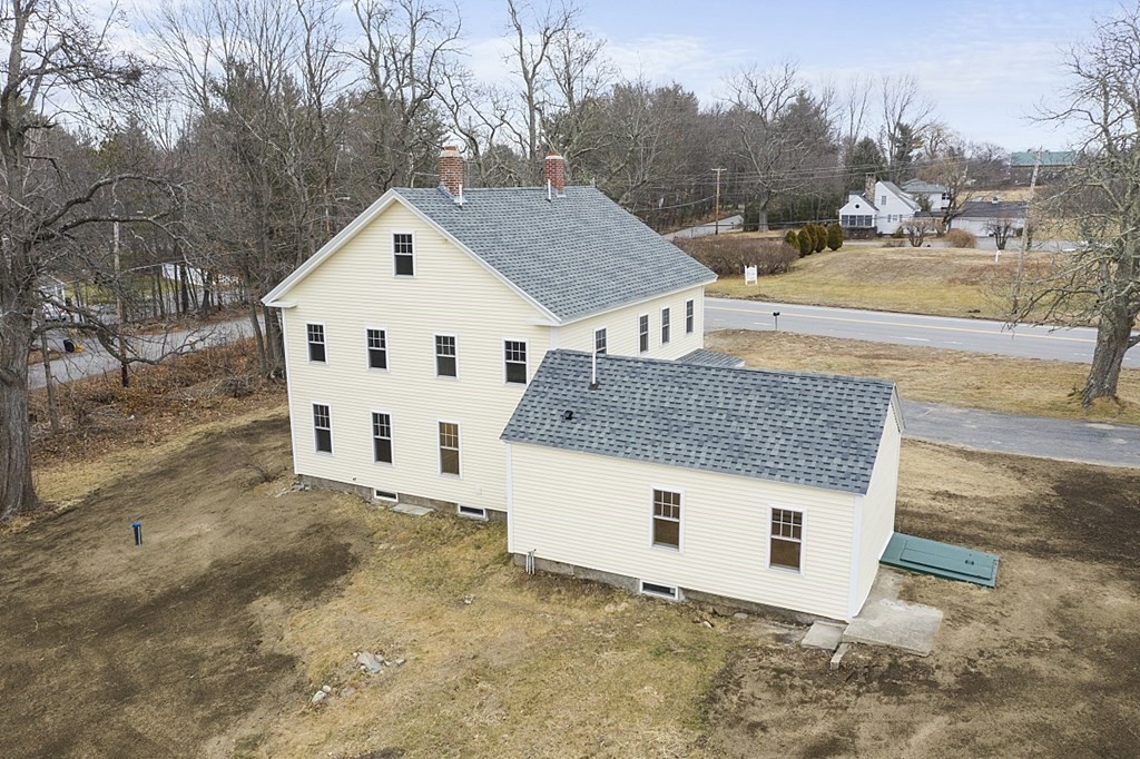 335 Chase Road Lunenburg, MA 01462 - Photo 3 of 42 a view of a house with a yard and garage