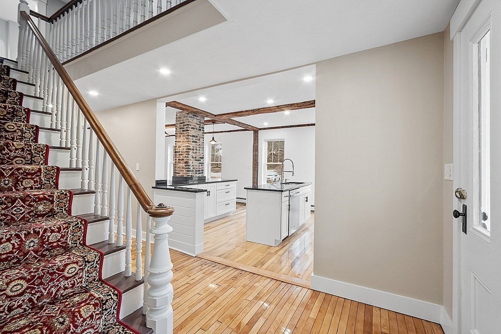 335 Chase Road Lunenburg, MA 01462 - Photo 6 of 42 a view of entryway with wooden floor and stairs