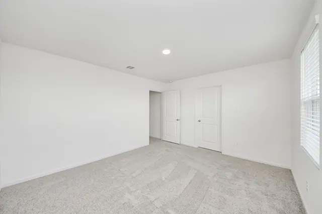 a bathroom with a shower sink and mirror