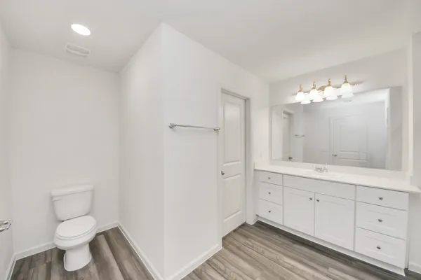 a bathroom with a sink a large mirror and shower