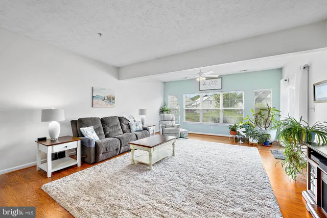 a view of kitchen with furniture and wooden floor