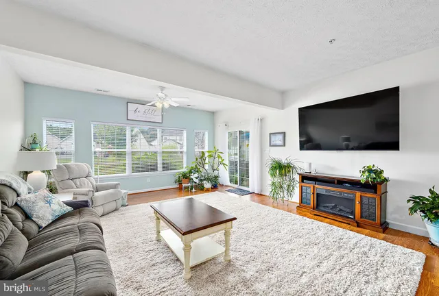 a kitchen with stainless steel appliances granite countertop a refrigerator sink and stove