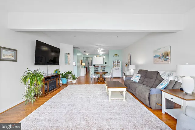a bedroom with a large bed and a flat screen television