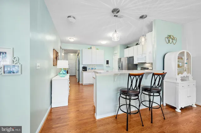 a bathroom with a sink a toilet and shower curtain