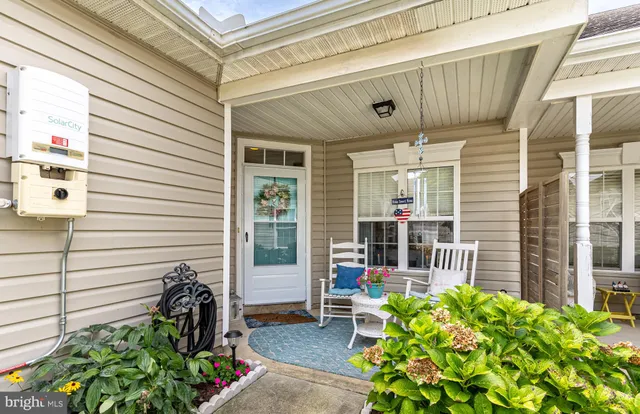 a view of a kitchen with wooden floor