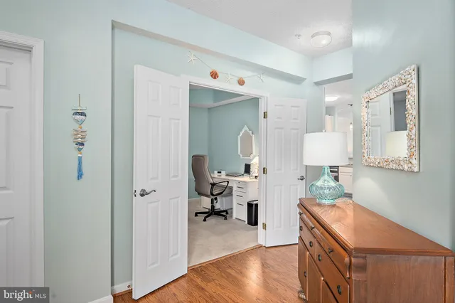 a view of a porch with a table and chairs and potted plants