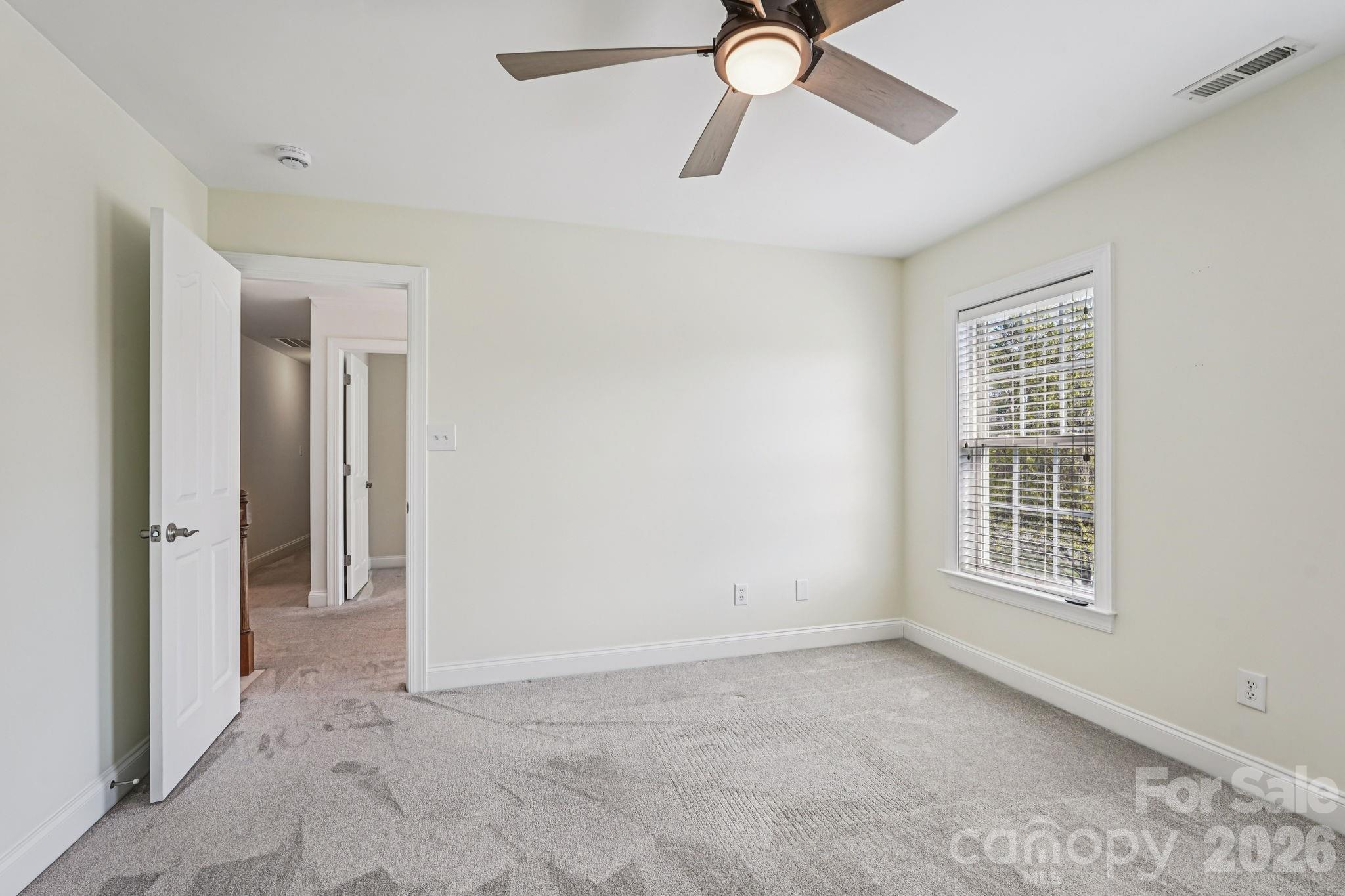 8348 Rocky River Road Harrisburg, NC 28075 - Photo 20 of 47 a view of an empty room with a window