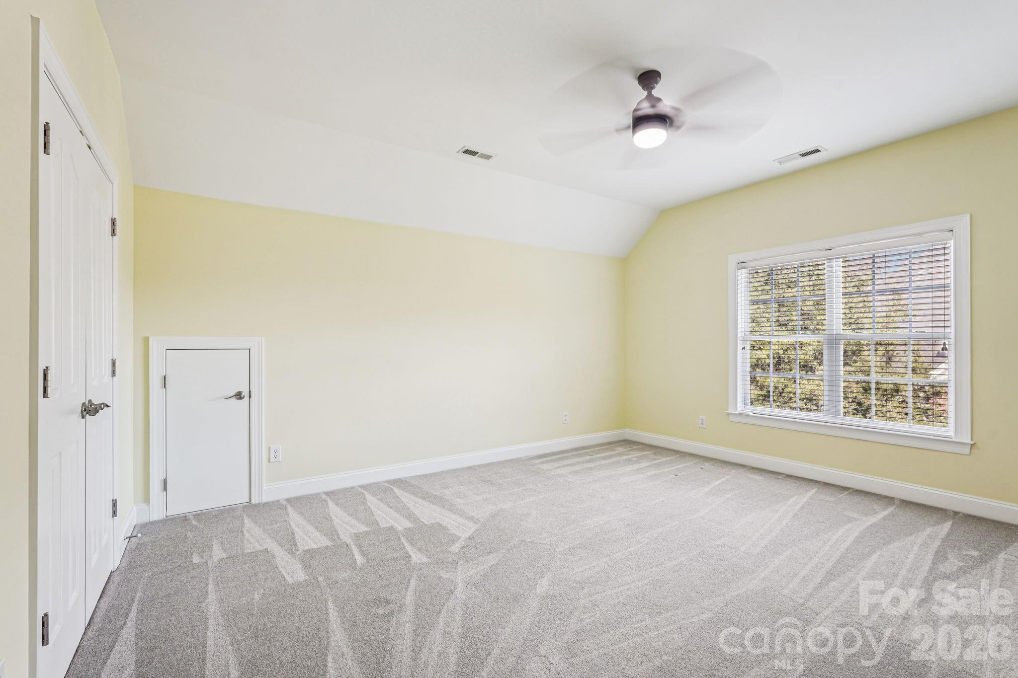 8348 Rocky River Road Harrisburg, NC 28075 - Photo 28 of 47 a view of an empty room with a window