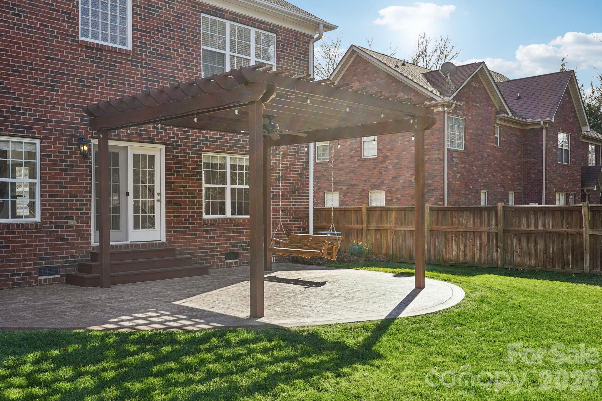 8348 Rocky River Road Harrisburg, NC 28075 - Photo 30 of 47 a view of a house with a backyard
