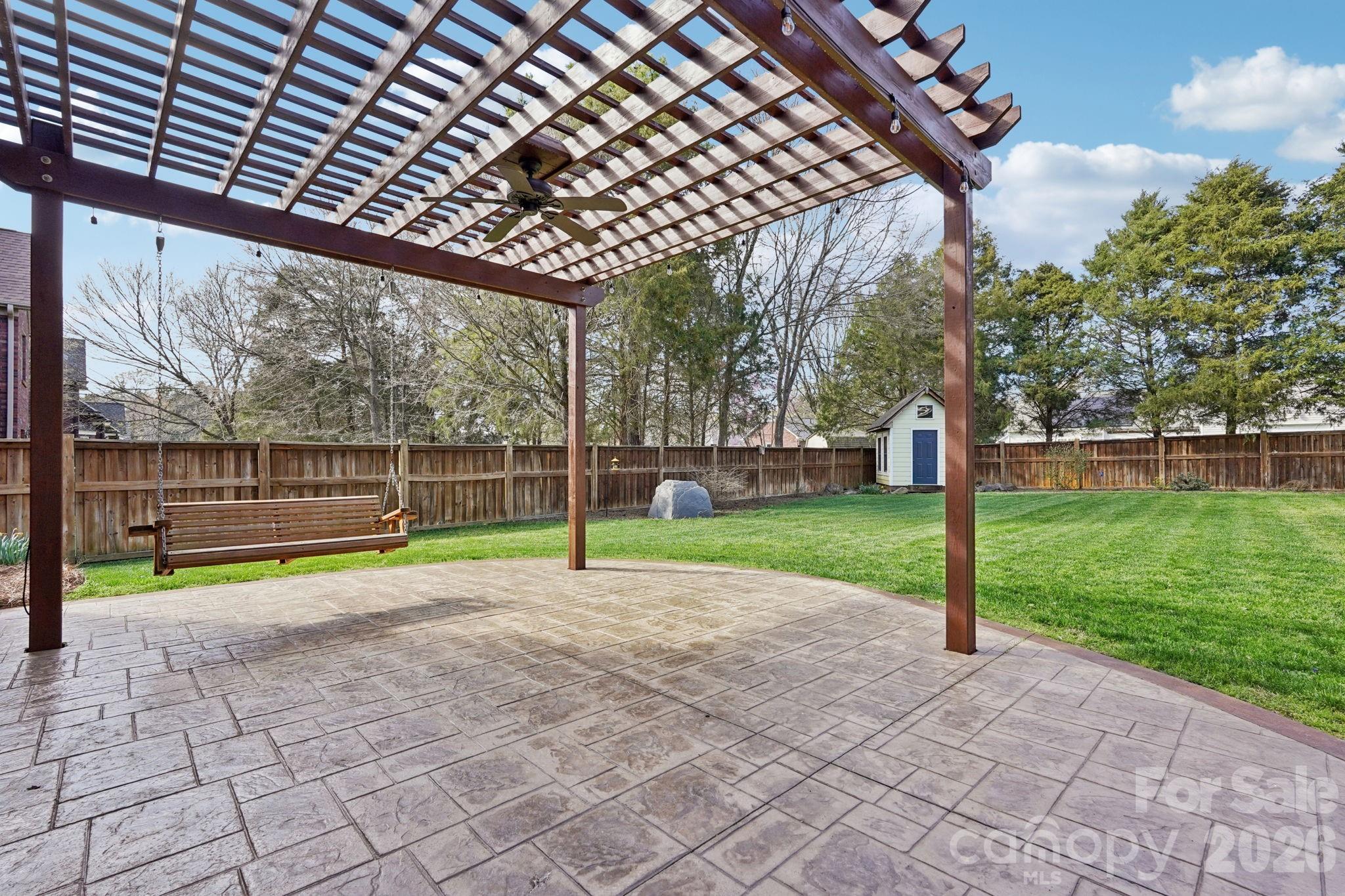 8348 Rocky River Road Harrisburg, NC 28075 - Photo 31 of 47 a view of a backyard with slide