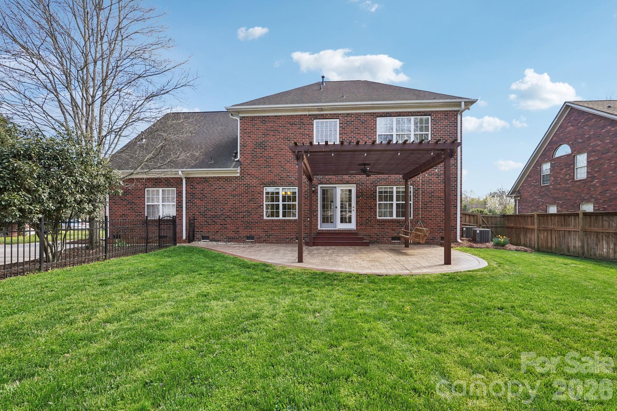 8348 Rocky River Road Harrisburg, NC 28075 - Photo 32 of 47 a front view of a house with a yard