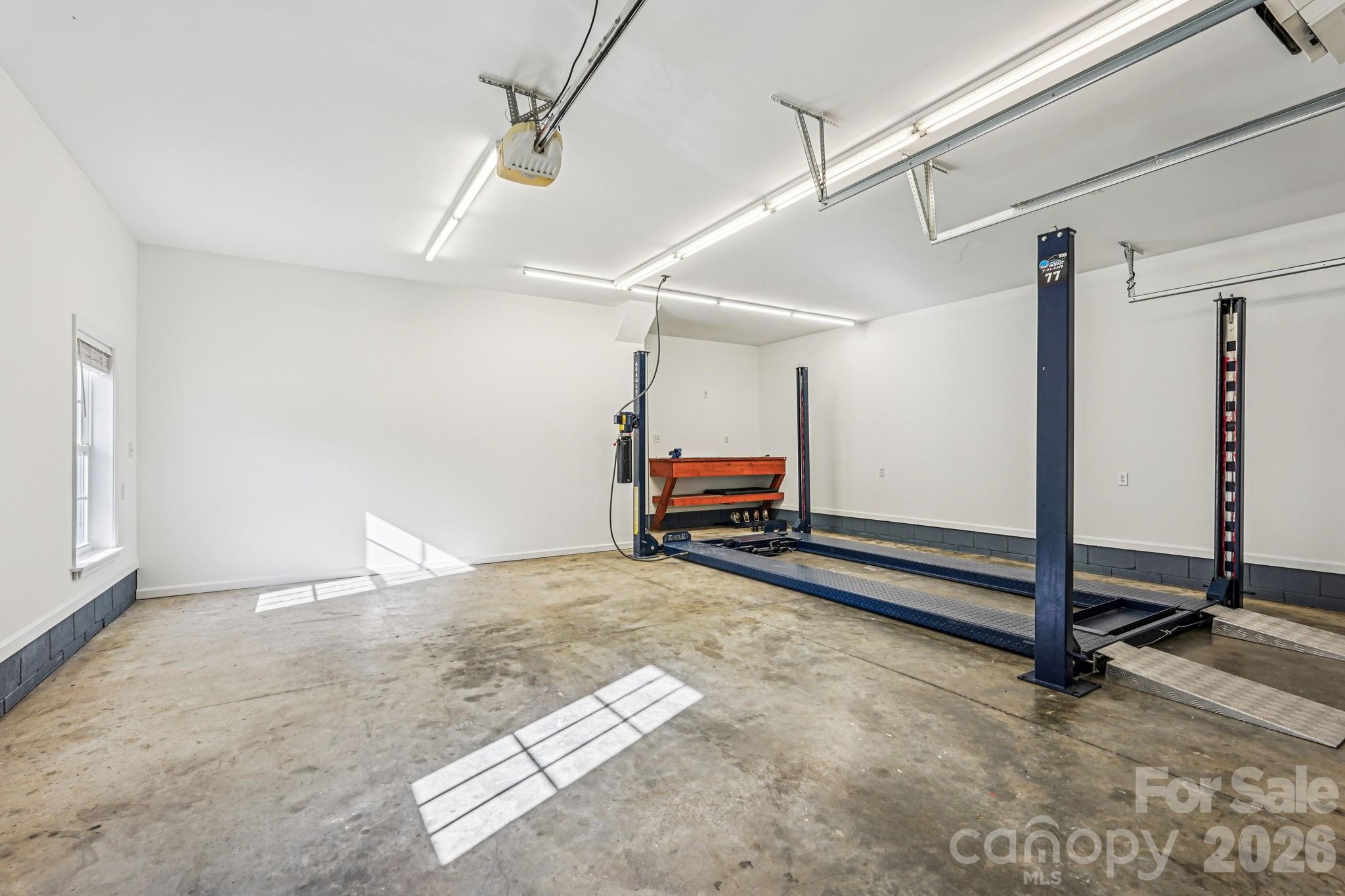 8348 Rocky River Road Harrisburg, NC 28075 - Photo 37 of 47 a view of a room with gym equipment