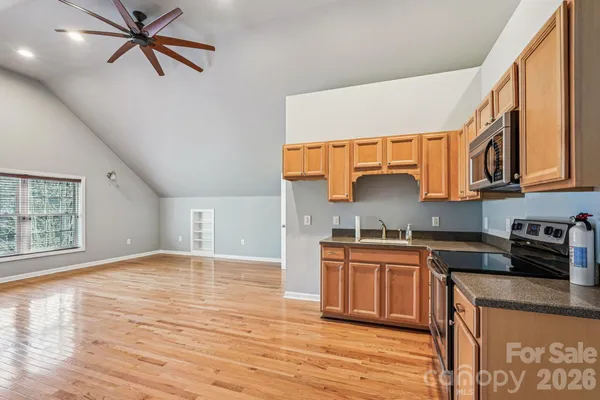a kitchen with stainless steel appliances granite countertop a stove and a sink