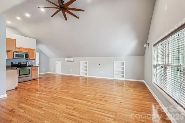 a view of a kitchen with microwave and stove