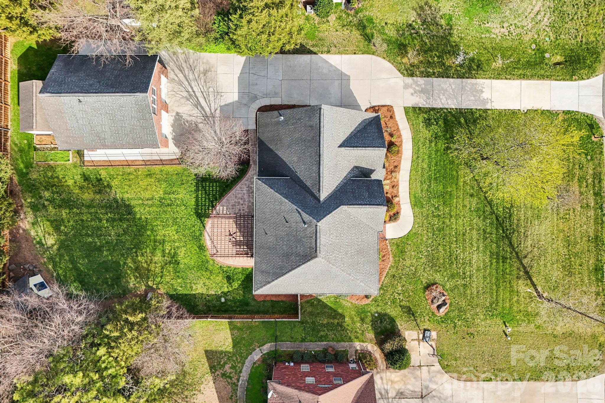 8348 Rocky River Road Harrisburg, NC 28075 - Photo 44 of 47 an aerial view of a house with garden space and street view