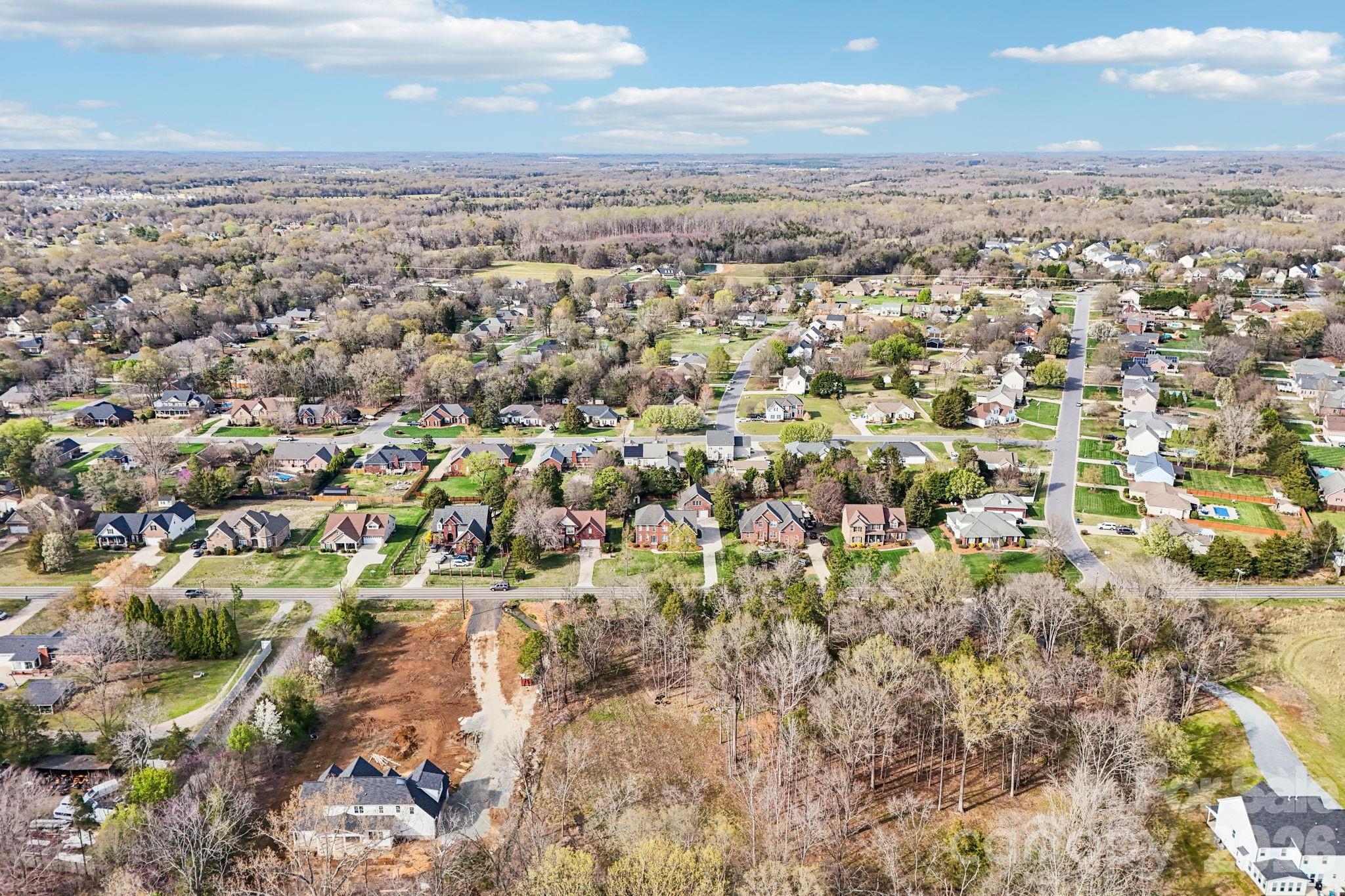 8348 Rocky River Road Harrisburg, NC 28075 - Photo 45 of 47 an aerial view of residential houses with outdoor space