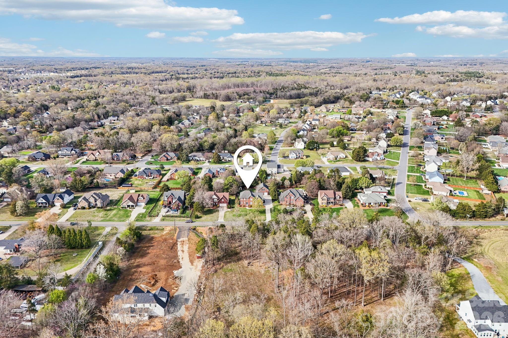 8348 Rocky River Road Harrisburg, NC 28075 - Photo 46 of 47 an aerial view of residential building and trees around
