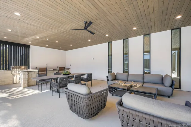 a view of a patio with table and chairs